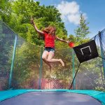 trampoline with basketball hoop