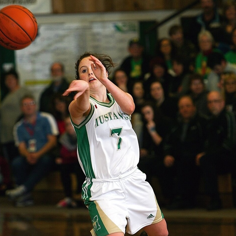 a girl basketball passing